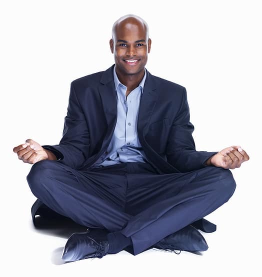 Smiling business man meditating on white