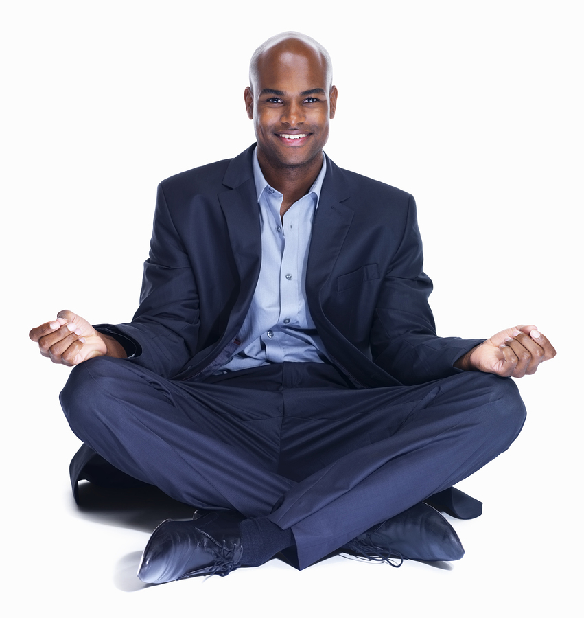 Smiling business man meditating on white